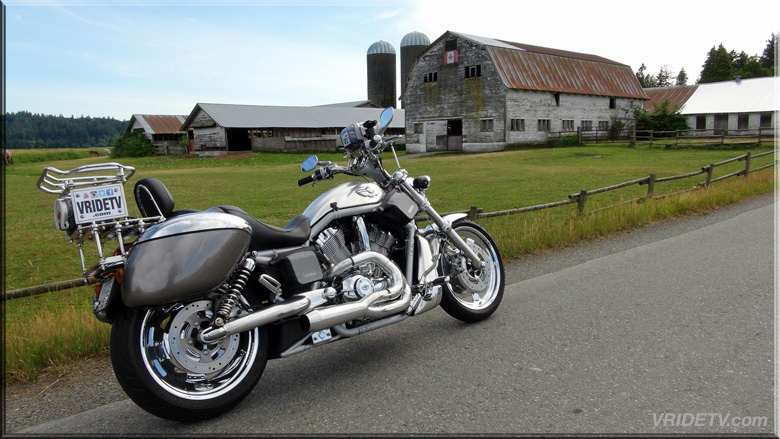 Harley Davidson motorcycle with a country farm