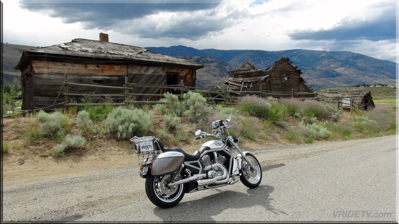 old buildings and a HARLEY motorcycle